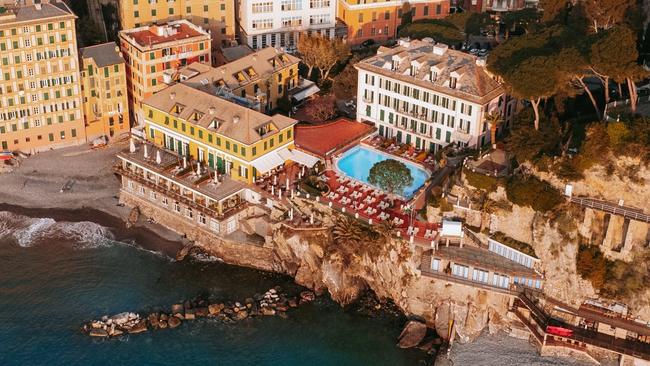 Cenobio dei Dogi hotel perches on a cliff overlooking the ocean.