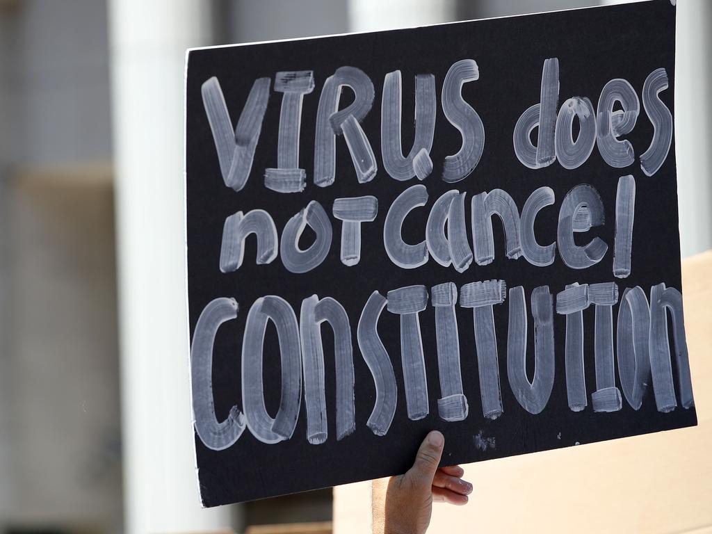 Activists hold signs to protest the California lockdown. Picture: Sean M. Haffey/Getty Images/AFP