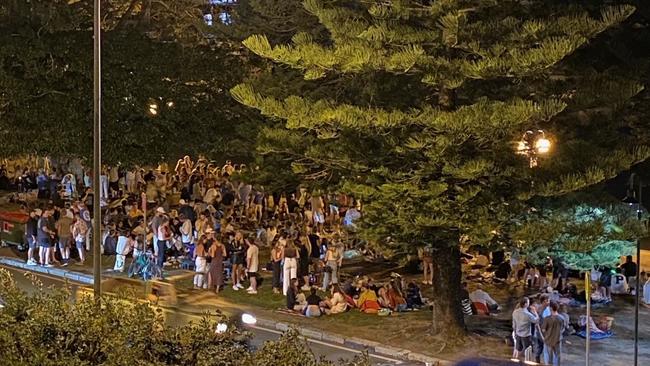 A photograph, taken by a resident, of revellers in East Esplanade Park at Manly on Friday night. Picture: Supplied