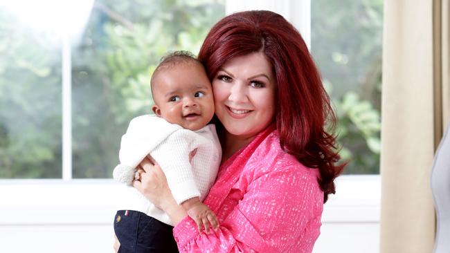 Brisbane PR queen Fleur Madden with miracle baby Josiah. Photo AAP/ Ric Frearson