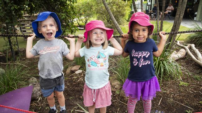 Van Kurz, Anna Madden and Ruby Baguley-Gela playing at Everton Park Child Care which has been rated excellent by the Australian Children's Education and Care Quality Authority. Photo: Lachie Millard