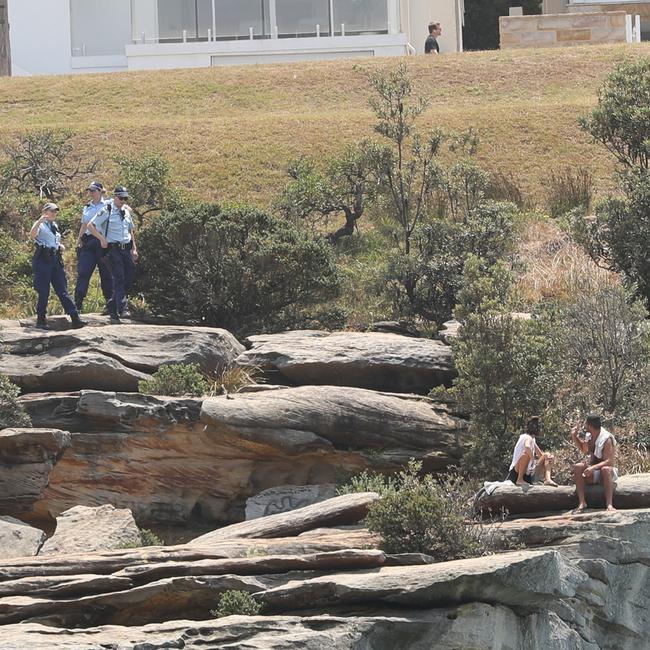 Police warn people sitting at the cliff’s edge. Picture: John Grainger