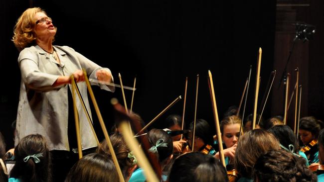 Music teacher Karen Carey with her students in scene from 2011 documentary film 'Mrs Carey's Concert'.