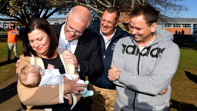 Prime Minister Scott Morrison and wife Jenny are seen with the Liberal candidate for Braddon, Gavin Pearce (rear second right) at Ulverstone Secondary College. Picture: AAP