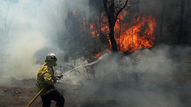 RFS fire crews working to save properties on Ivatt St in Cobar Park, near Lithgow, on Saturday. Picture: Tim Hunter