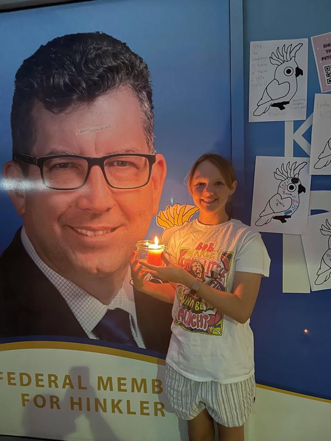 More than 30 Bundaberg residents have come together by candlelight, calling for an asylum seeker family with two young Australian-born children to be released from detention.