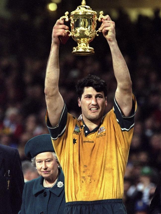 Wallabies captain John Eales raises the Webb Ellis trophy after winning the 1999 Rugby World Cup.