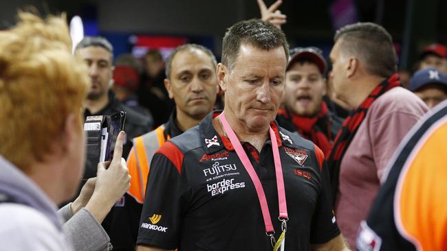 Bombers coach John Worsfold cops it from fans as he makes his way onto the field. Picture: AAP