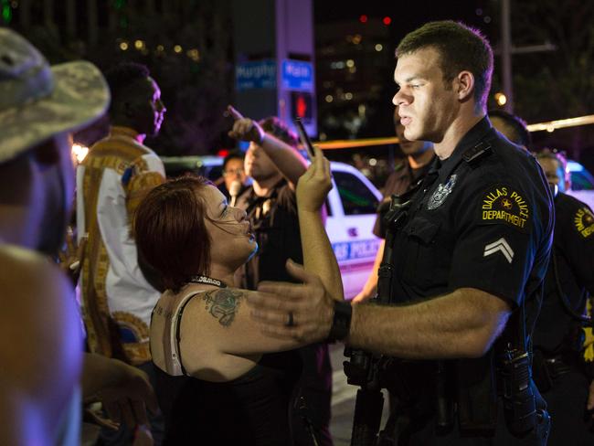 Police attempt to calm the crowd following the sniper shooting of police in Dallas on July 7, 2016. Picture: AFP