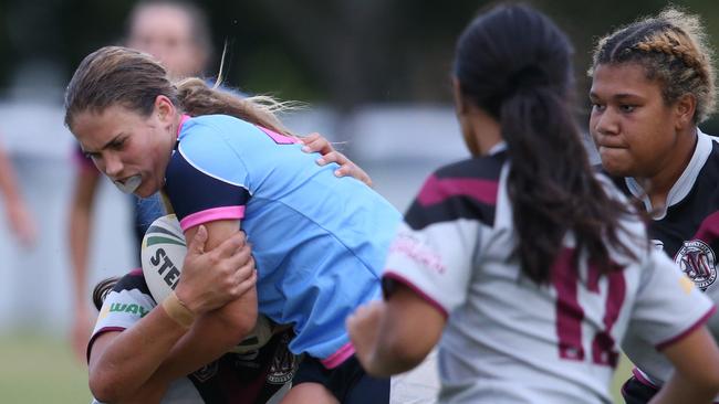 Marymount’s Lola Jenkins tackled. Picture: Glenn Hampson