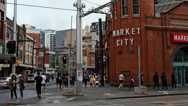 Pavers and artwork on the corner of Hay and Thomas streets in Haymarket have been replaced by bitumen. Picture: Toby Zerna