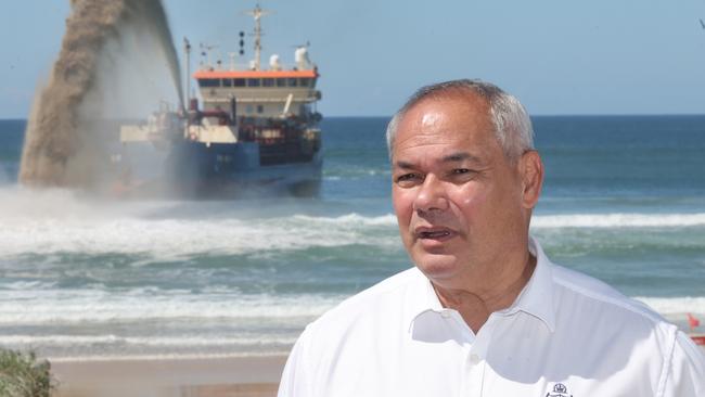 The dredge is back pumping off Surfers Paradise beach and is proving quite an attraction for holidaymakers.Mayore Tom Tate talks to media.. Picture Glenn Hampson