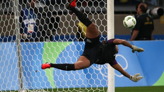 Brazil goalkeeper Barbara stops a penalty.