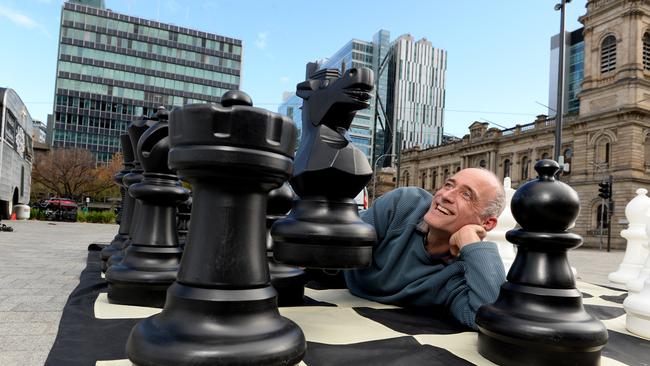 David Koetsier among large chess pieces is running chess classes in Victoria square. Picture Campbell Brodie.