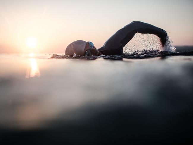 Portrait of a determined male swimmer in action