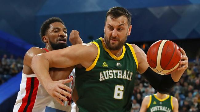 Andrew Bogut protects the ball during one of Australia’s recent exhibition matches against Canada. Picture: Paul Kane/Getty Images.