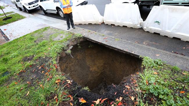 A sink hole has opened under a footpath in North Hobart. Picture: NIKKI DAVIS-JONES