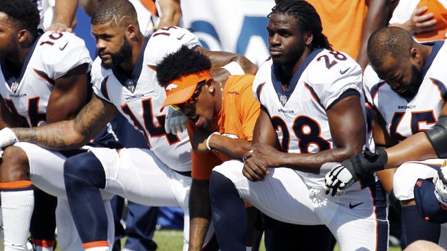 Denver Broncos players taking a knee. Pic: AP