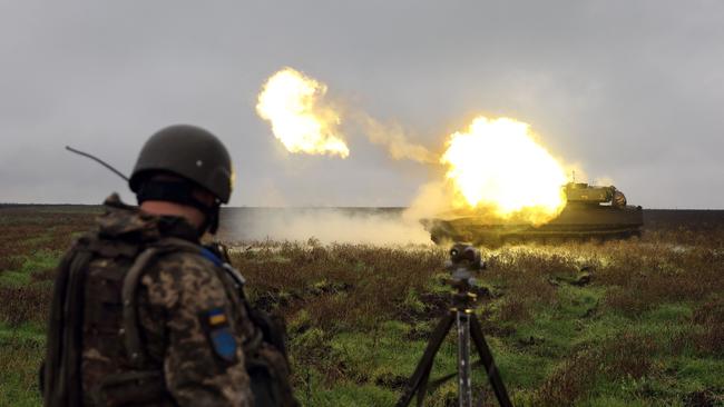 A Ukrainian soldier observes as a 2S1 Gvozdika self-propelled howitzer fires on the front line in the eastern Donetsk region this week. Picture: AFP