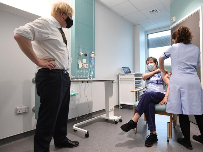 British Prime Minister Boris Johnson watches as junior sister Susan Cole is injected with the Oxford/AstraZeneca Covid-19 vaccine. Picture: Getty Images