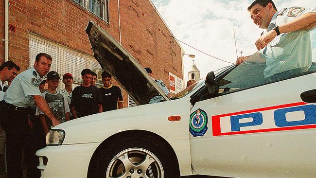 Road saftey day at Parramatta PCYC with Senior Constables Adrian Grech and Peter Borg and a highway patrol car in January 2000. Picture: John Appleyard