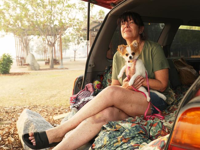 Batemans Bay local Jasmin Brett and her pup Lilly have moved into town at the river’s edge for safety. Picture: John Grainger