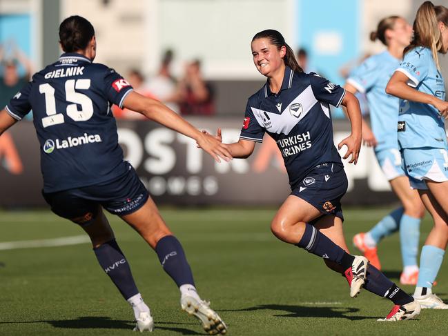 MELBOURNE, AUSTRALIA - FEBRUARY 01: Rachel Lowe of Melbourne Victory celebrates scoring a goal with Emily Gielnik of Melbourne Victory during the round 14 A-League Women's match between Melbourne City and Melbourne Victory at City Football Academy, on February 01, 2025, in Melbourne, Australia. (Photo by Kelly Defina/Getty Images)