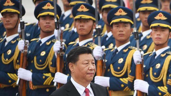 Chinese President Xi Jinping walks past a military honour guard outside the Great Hall of the People in Beijing. Picture: Greg Baker / AFP