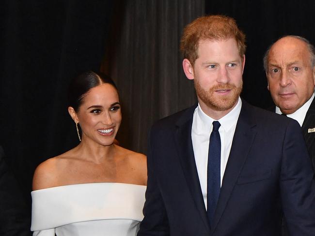 (FILES) Prince Harry, Duke of Sussex, and Meghan, Duchess of Sussex, arrive at the 2022 Robert F. Kennedy Human Rights Ripple of Hope Award Gala at the Hilton Midtown in New York City on December 6, 2022. Prince Harry and wife Meghan Markle were involved in a "near catastrophic car chase" involving paparazzi in New York late on May 16, 2023, a spokesperson for the couple said May 17. "This relentless pursuit, lasting over two hours, resulted in multiple near collisions involving other drivers on the road, pedestrians and two NYPD officers," the spokesperson added. (Photo by ANGELA WEISS / AFP)