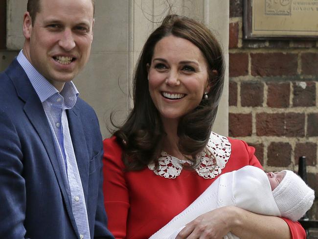 Prince William and Kate, Duchess of Cambridge smile as they hold their newborn baby son as they leave St Mary's Hospital in London. Picture: AP Photo/Tim Ireland