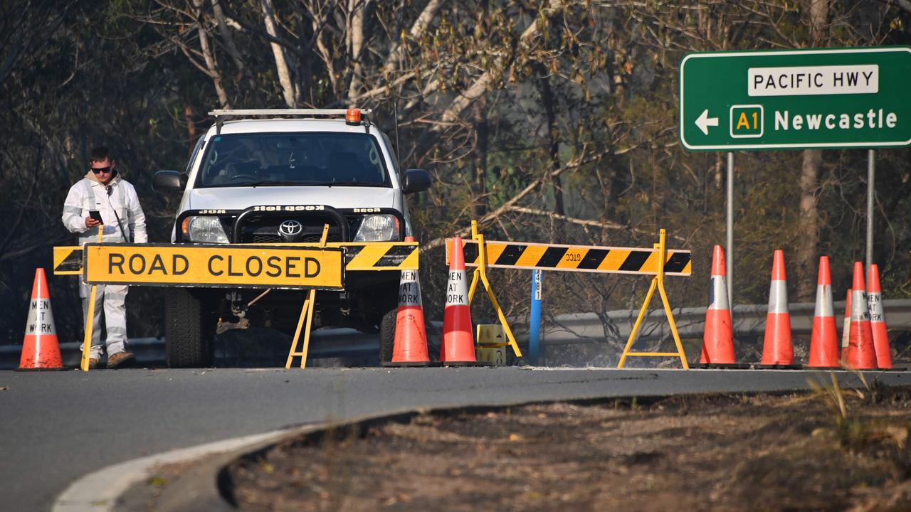 Motorists who need to travel in bushfire affected areas should be prepared for conditions to change quickly. Picture: Peter Parks/AFP