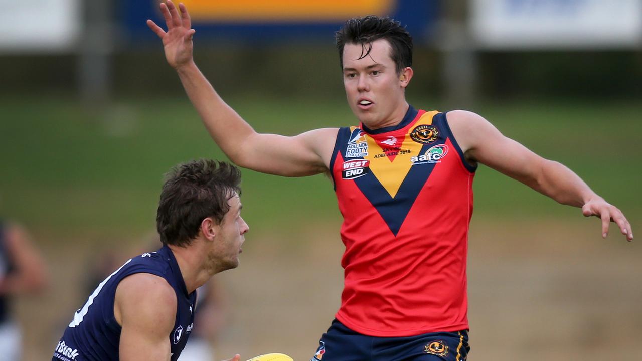 State amateur footy game - SA v Victoria at Thebarton Oval, 8 June 2018. Victoria's Nick Wood marks in front of SA's Trent Heffernan. (AAP Image/Dean Martin)