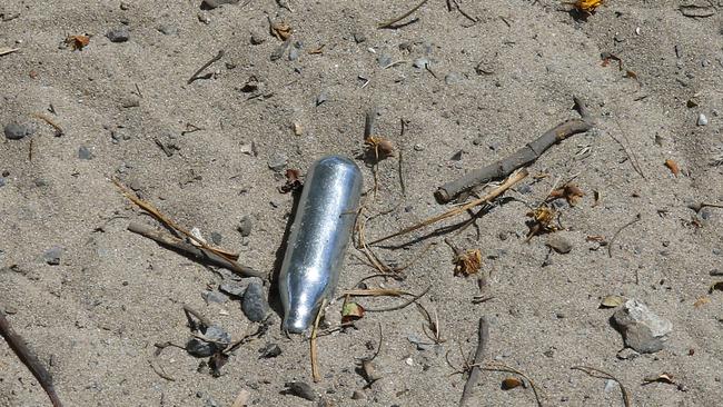 A used nitrous oxide canister on the site of abandoned homes in Budds Beach. Picture: Tertius Pickard