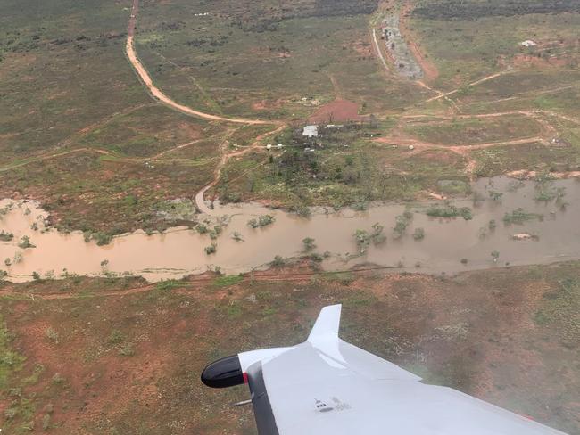 Cops and emergency service workers search for those stranded in the flooded Tanami Desert. Picture: NT Police