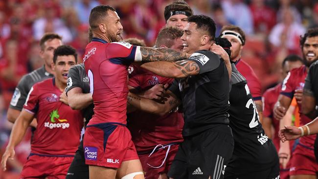 Quade Cooper and Codie Taylor clash during the match at Suncorp Stadium. Picture: AAP