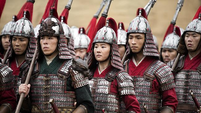 Mulan (Yifei Liu), centre, in a scene from the film. Picture: Jasin Boland