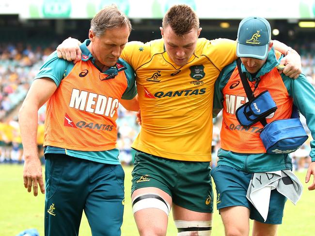 SYDNEY, AUSTRALIA - OCTOBER 28:  Jack Dempsey of the Wallabies is helped from the field during the match between the Australian Wallabies and the Barbarians at Allianz Stadium on October 28, 2017 in Sydney, Australia.  (Photo by Mark Kolbe/Getty Images)
