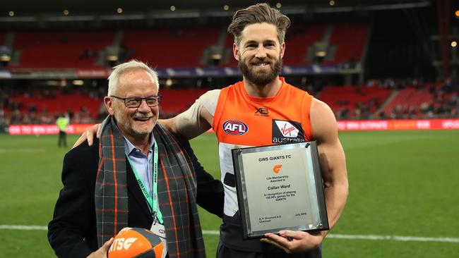 Tony Shepherd presents Callan Ward with his life membership. Picture: Phil Hillyard