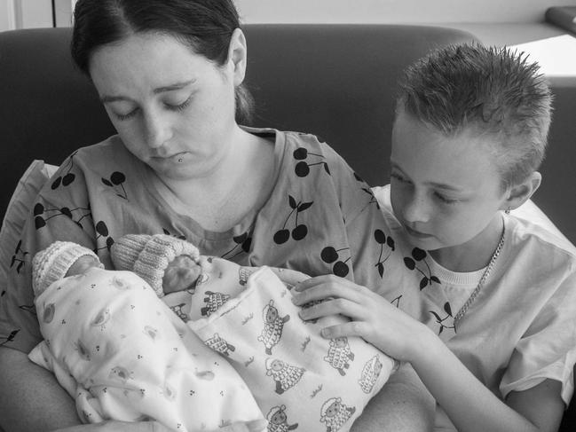 GRAPHIC CONTENT WARNING . Cassandra and her husband Jake Oest with their twins Ellie and Aiden after they passed away. Picture: Supplied by family