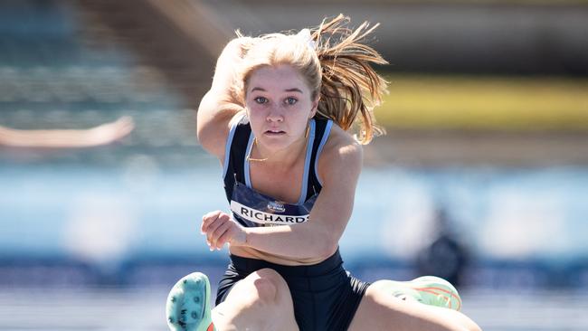 Alexandra Richards winning the girls 100m hurdles 17 years.