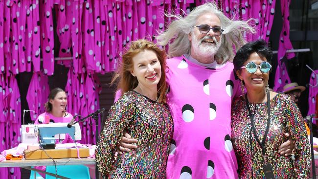 David Walsh, centre, with wife Kirsha Kaechele, left, and Varuni Kulasekera in their onesies during the Mofo Block Party at Inveresk. Picture: CHRIS KIDD