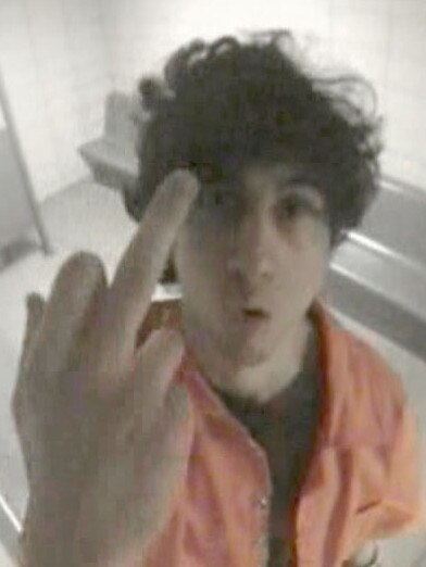 Tsarnaev is seen giving the middle finger to a security camera inside his jail cell three months after he was arrested in the terror attack.