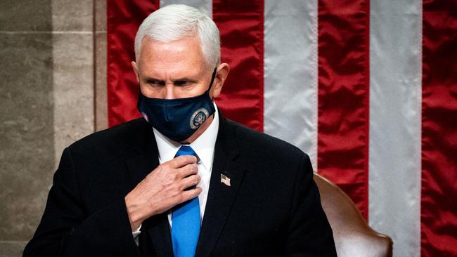 Mike Pence presides over a Joint session of Congress to certify the 2020 Electoral College results minutes before he was rushed to safety. Picture: AFP.