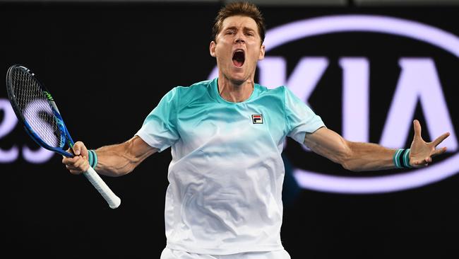 Matthew Ebden celebrates after winning his first-round match.