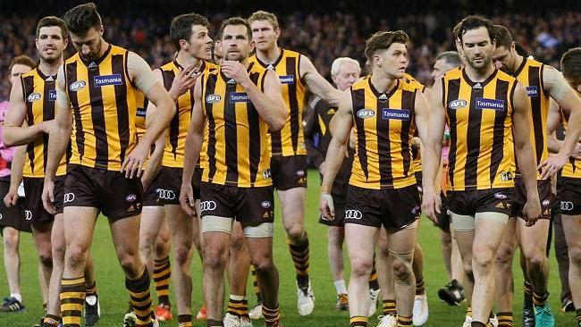 Hawthorn players walk off the MCG. Picture: Michael Klein