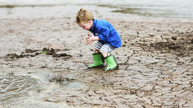 When it rains at Breeza Station on the Liverpool Plains, Archie Pursehouse, 2, hits the ground running. Picture: Peter Lorimer