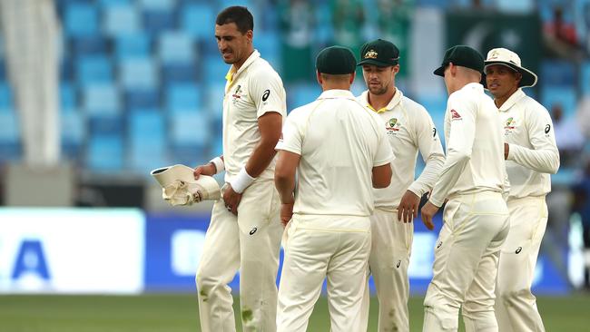 DUBAI, UNITED ARAB EMIRATES - OCTOBER 07:  Mitchell Starc of Australia reacts at stumps during day one of the First Test match in the series between Australia and Pakistan at Dubai International Stadium on October 7, 2018 in Dubai, United Arab Emirates.  (Photo by Ryan Pierse/Getty Images)