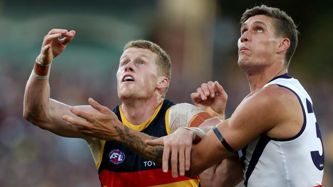  Reilly O'Brien competes with Rory Lobb of the Dockers. Picture: James Elsby/AFL Photos/Getty Images