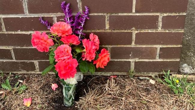 Flowers outside the Greensborough home where the man was killed.