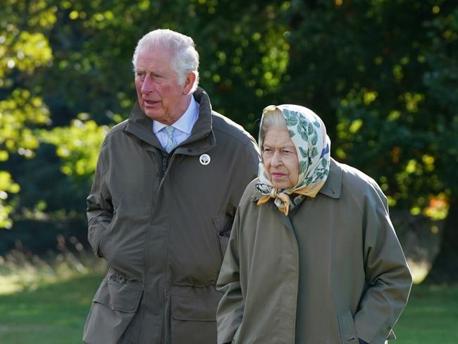 Queen Elizabeth and Prince Charles, Prince of Wales walk to the Balmoral Estate Cricket Pavilion on October 1, 2021 near Crathie, Scotland. Picture: Andrew Milligan-WPA Pool/Getty Images